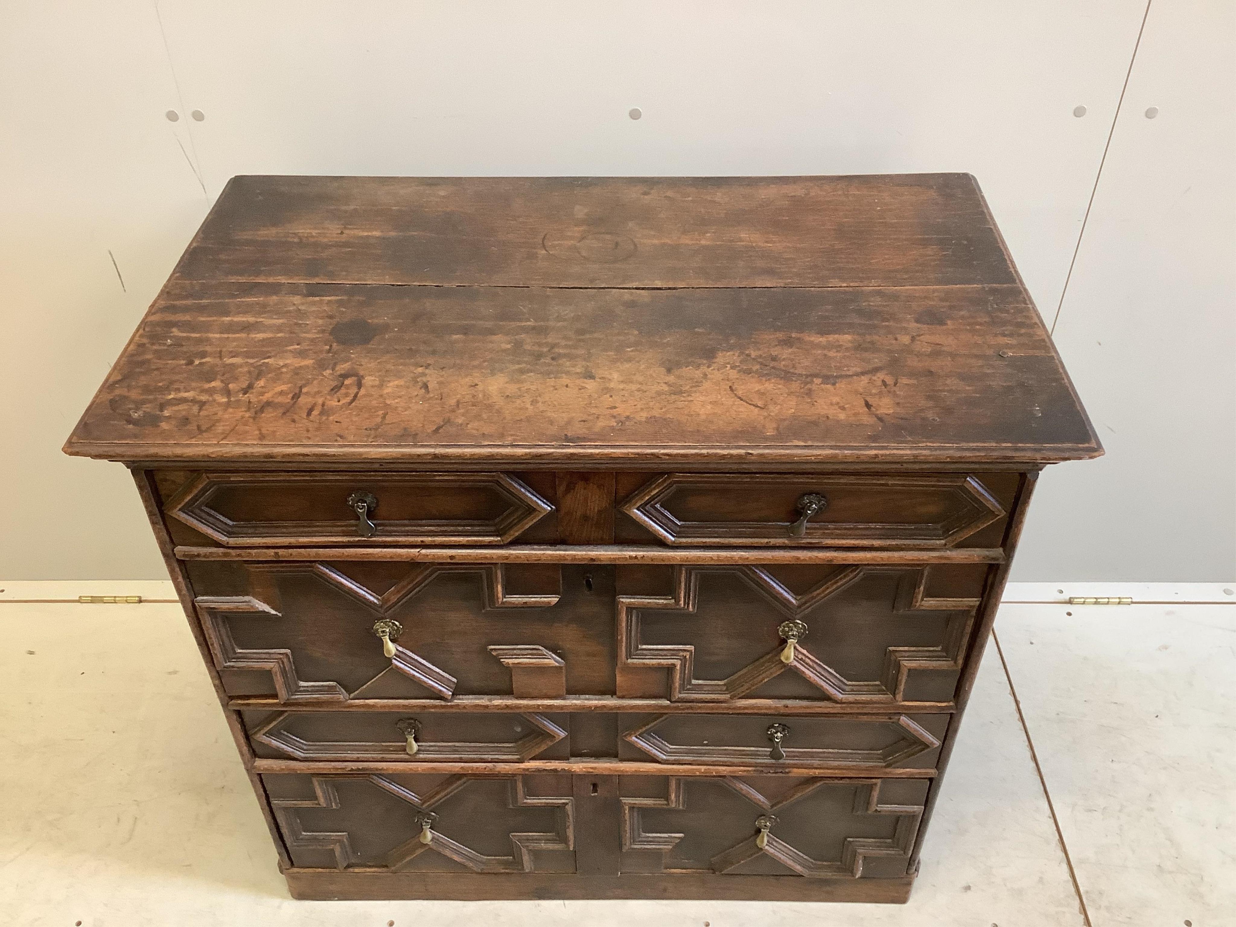 An 18th century geometric moulded oak chest, width 95cm, depth 54cm, height 86cm. Condition - fair